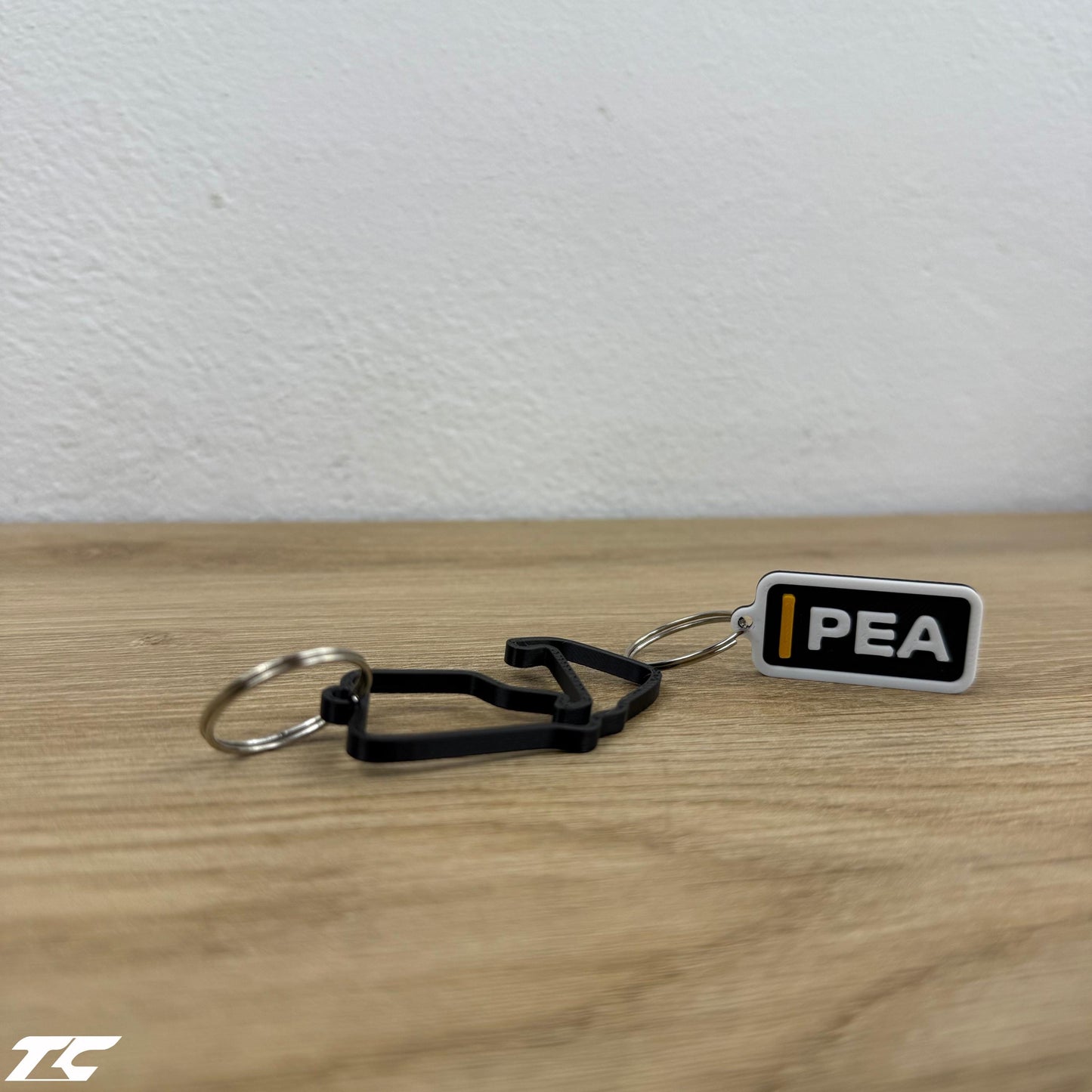 F1 The Movie Keychain Set – Driver Tag + Circuit Track | Sonny Hayes or Joshua Pearce