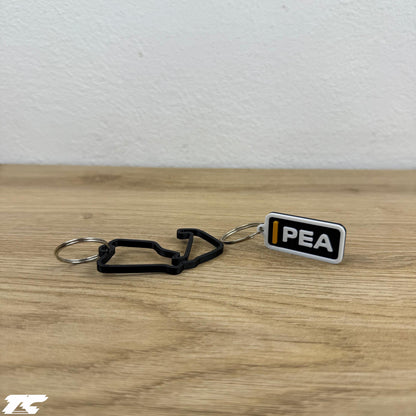 F1 The Movie Keychain Set – Driver Tag + Circuit Track | Sonny Hayes or Joshua Pearce