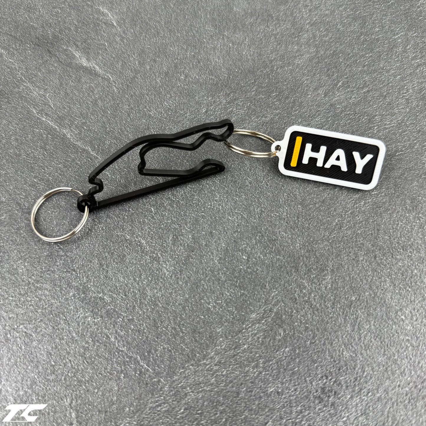 F1 The Movie Keychain Set – Driver Tag + Circuit Track | Sonny Hayes or Joshua Pearce